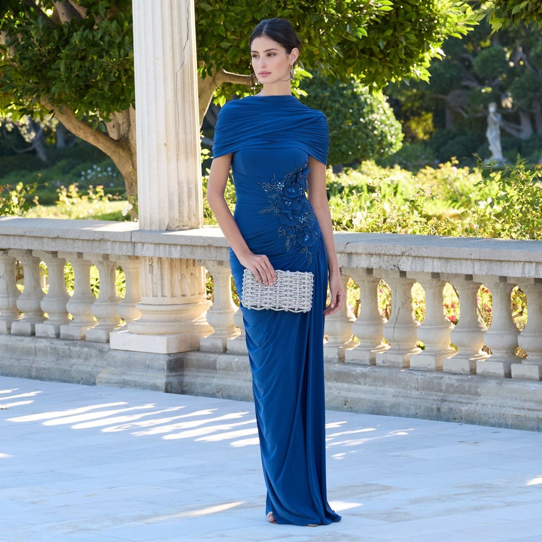mac duggal gowns & formal dresses Navy Crepe Gown With Floral Embellished Sleeves Linear sequins elongate the form Purple Puff Sleeve Embellished A