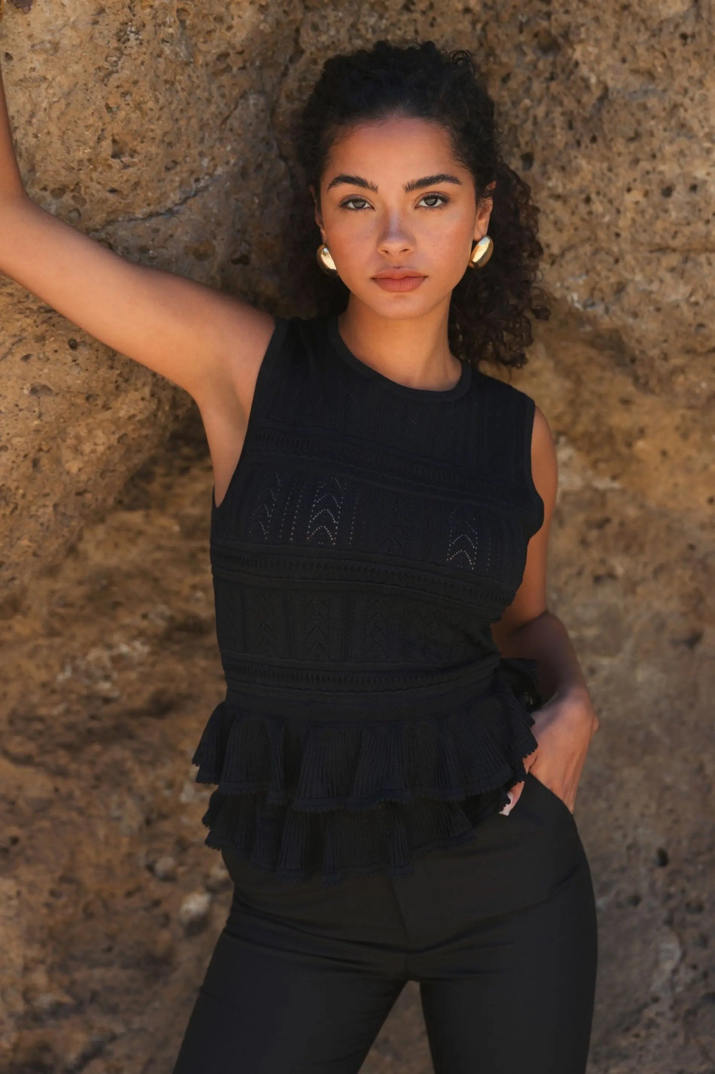 Black Sleeveless High Neck Knit Top With Ruffle Hem - FINAL SALE - Mac Duggal