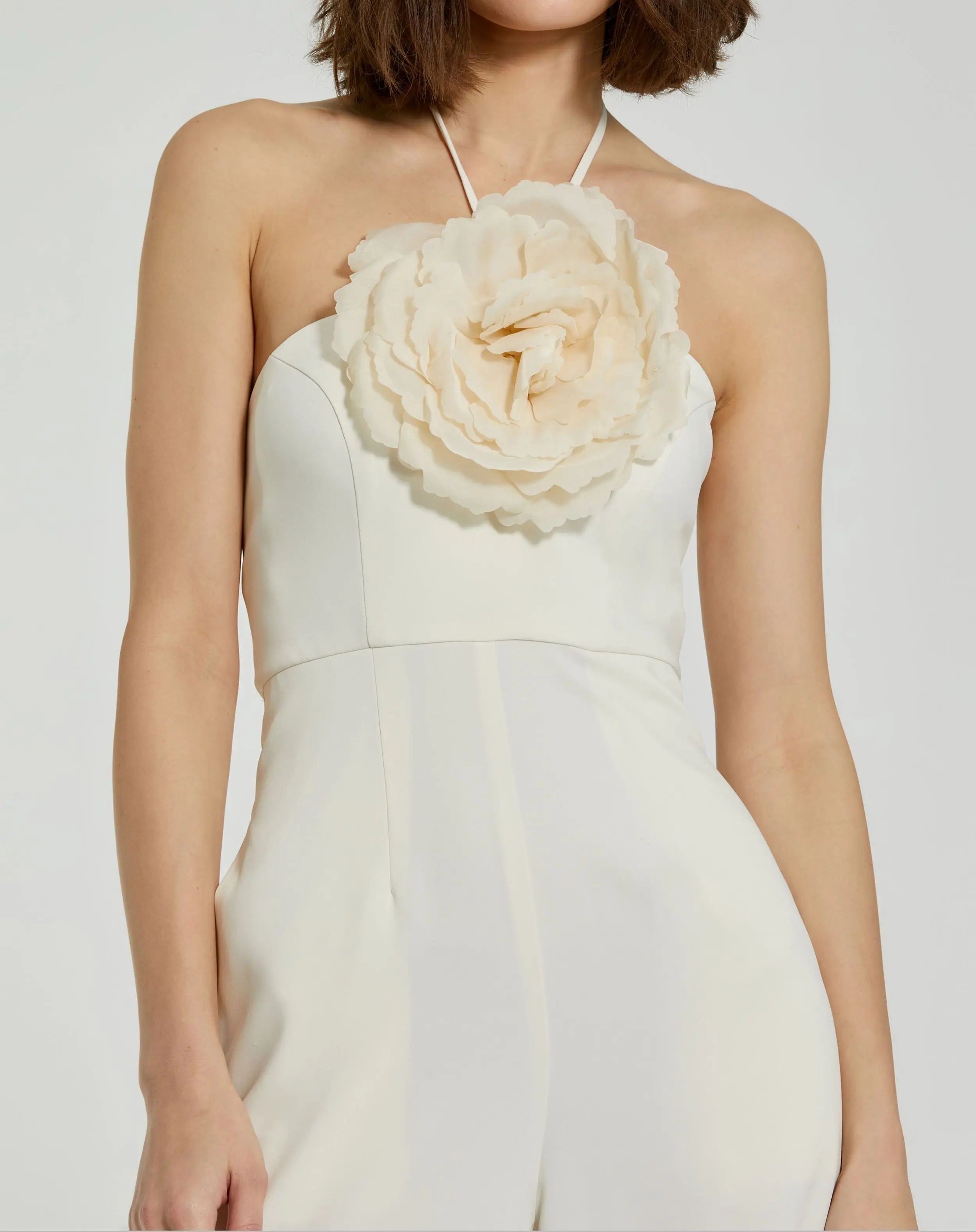 White Crepe Halter Neck Jumpsuit With Flower - Mac Duggal