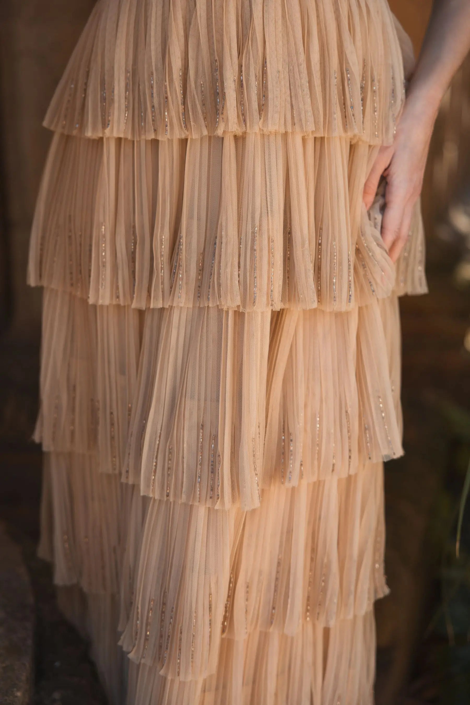 Beige Beaded Mesh V Neck Gown With Tiered Ruffles Beige Beaded Mesh V Neck Gown With Tiered Ruffles