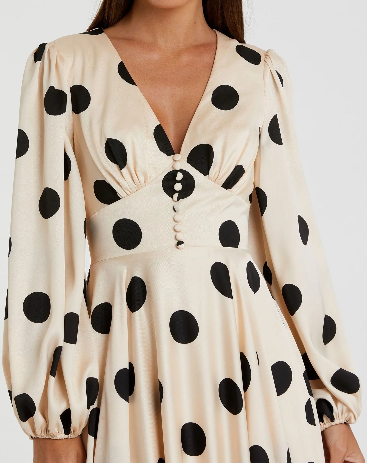 cream and black polka dot dress Poplin Mini Medium Mini lengthFully lined V neckline Back invisible zipper Ruffle on sleeves Gauze panels in skirt Front tiePicot trim detail on waist Light chiffon material Perfect for summer Magnolia Polka Dot Midi Dress,