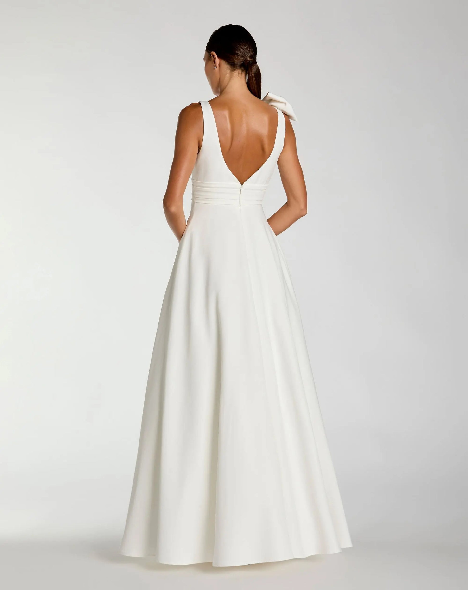 White Sleeveless Plunge Neck Crepe Ballgown With Bow Detail - Ieena for Mac Duggal