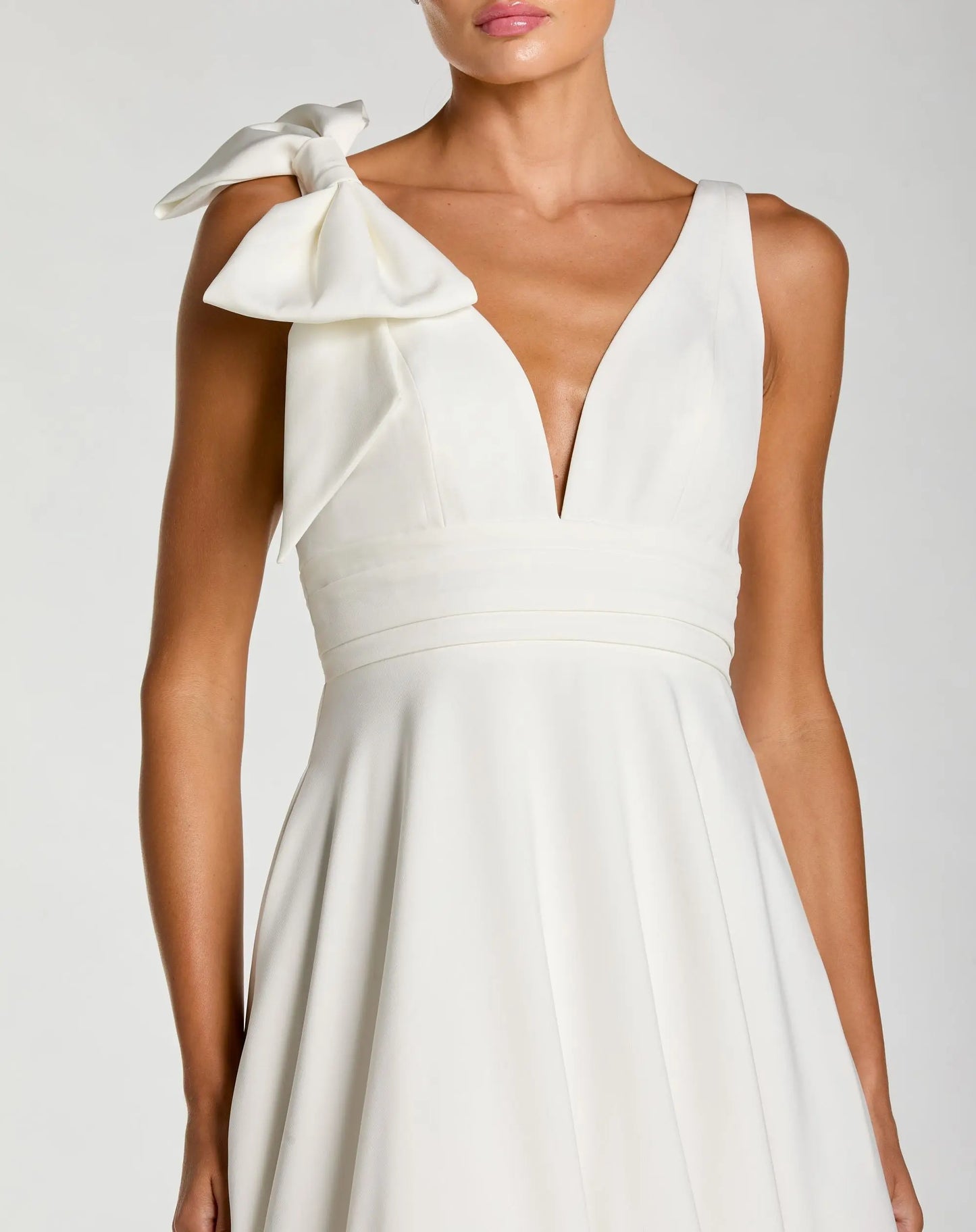 White Sleeveless Plunge Neck Crepe Ballgown With Bow Detail - Ieena for Mac Duggal