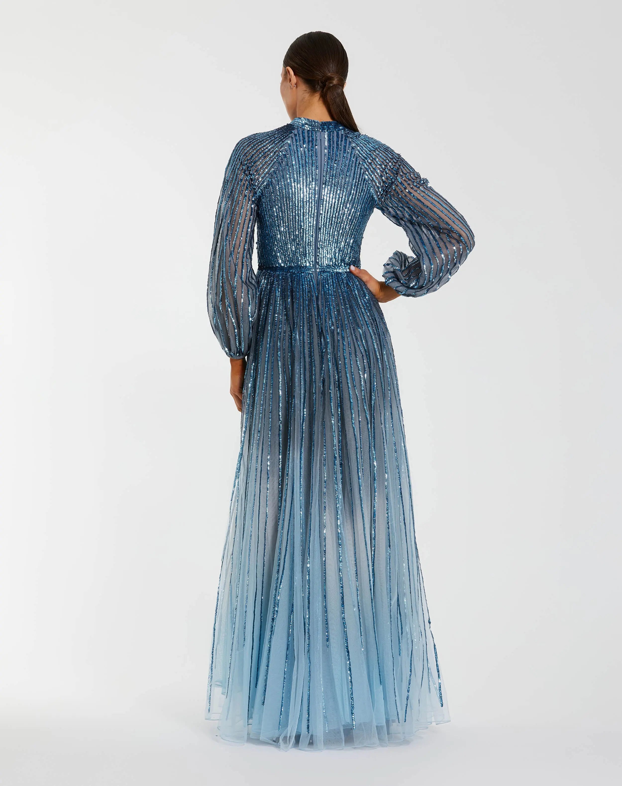 Back view of blue ombré sequin gown showing bishop sleeves and zipper