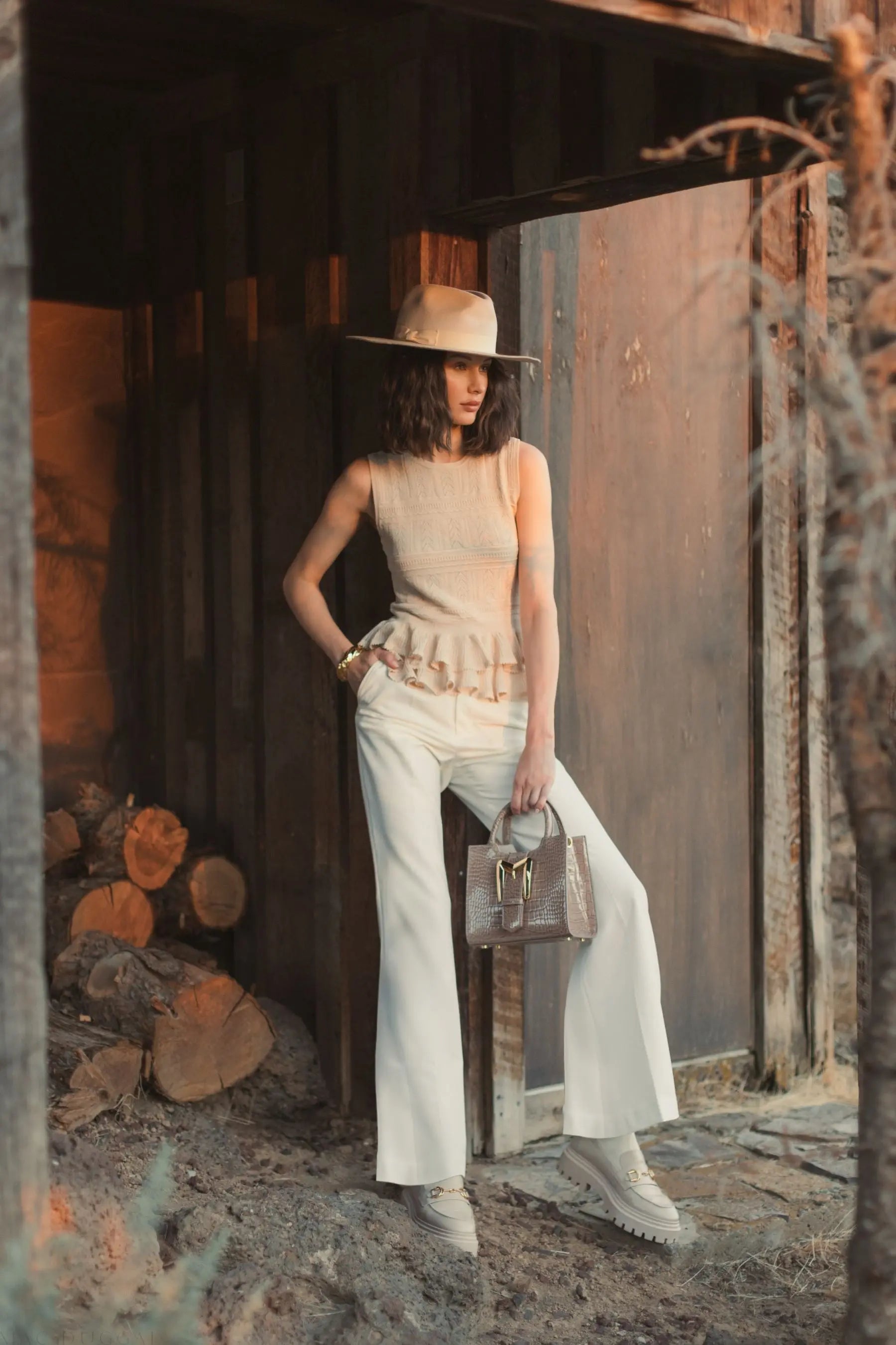 Beige Sleeveless High Neck Knit Top With Ruffle Hem - Mac Duggal