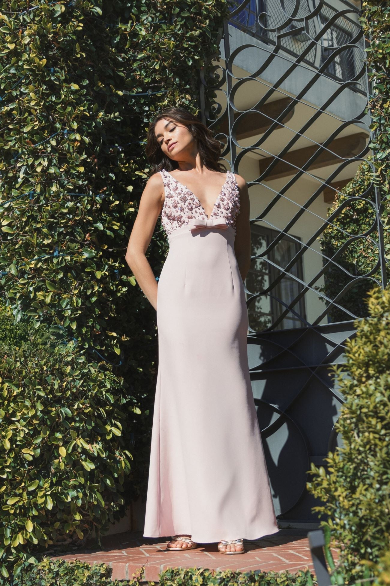 Pink Crepe Sleeveless Beaded V Neck Gown With Bow