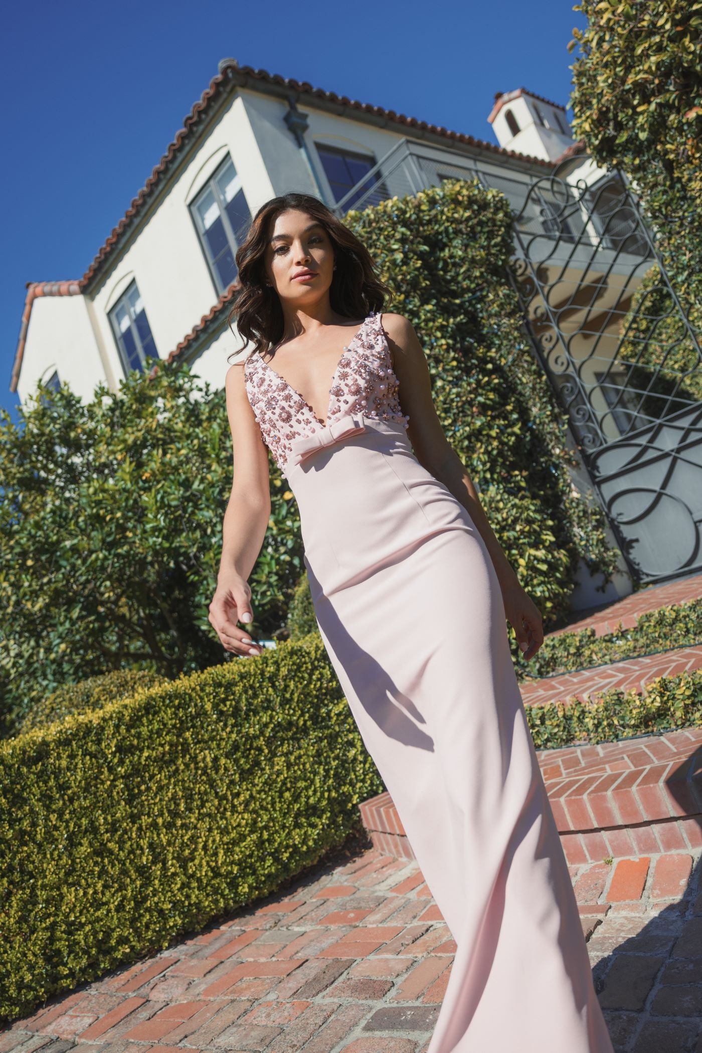 Pink Crepe Sleeveless Beaded V Neck Gown With Bow