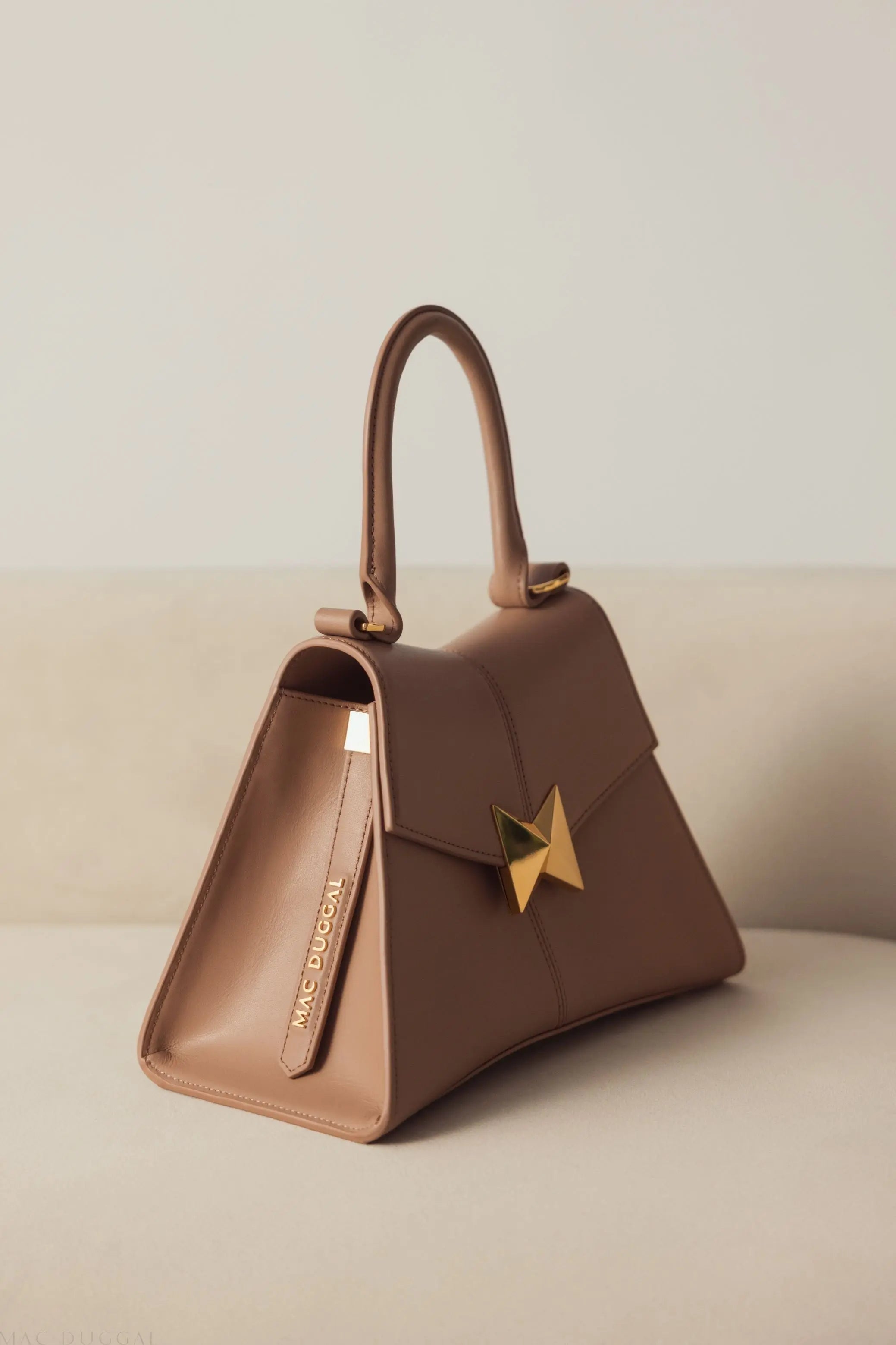 Angular Small Taupe Leather Handbag With Gold Hardware - Mac Duggal