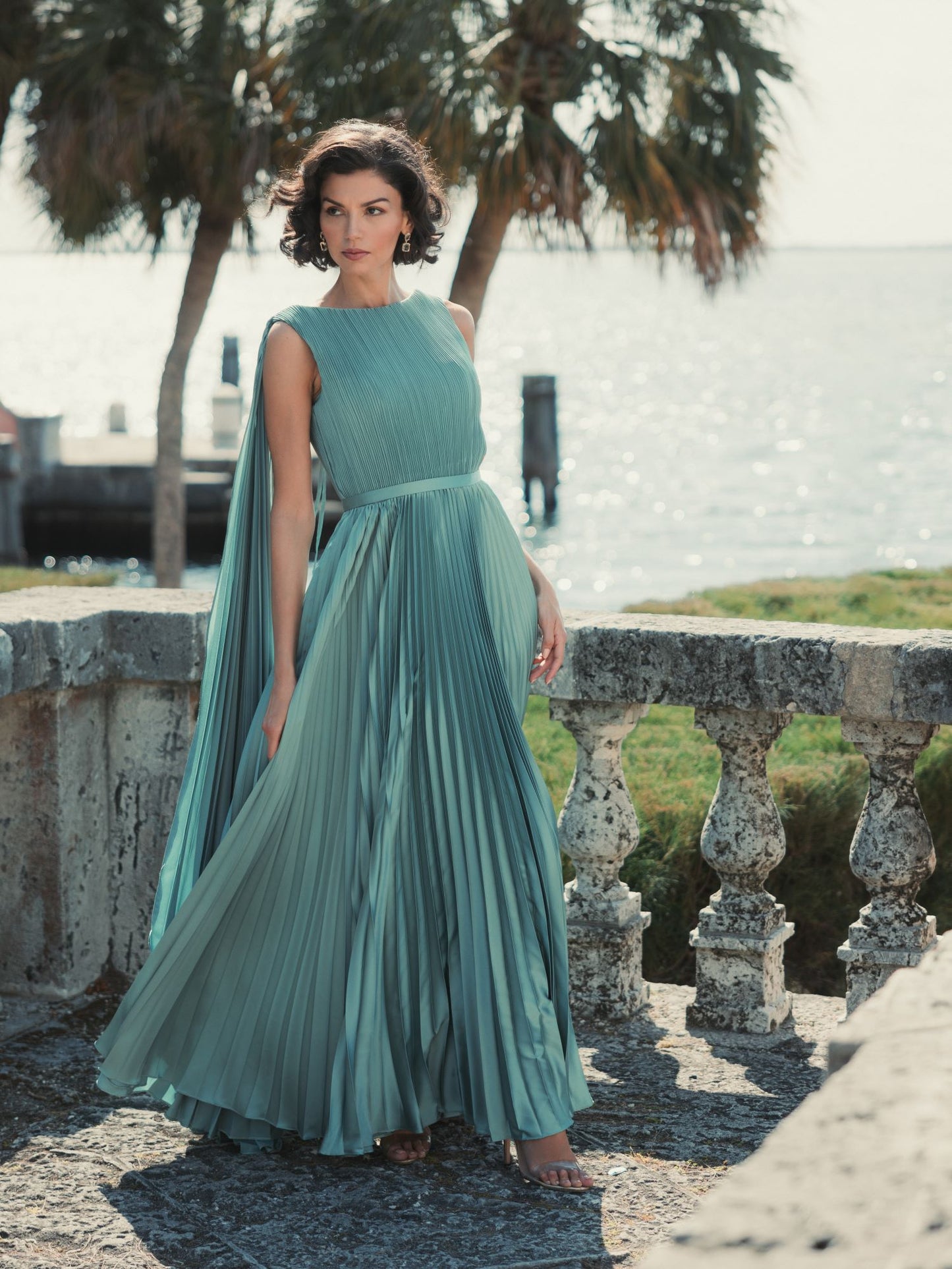 Sleeveless High Neck Cape Back Heat Pleated Gown