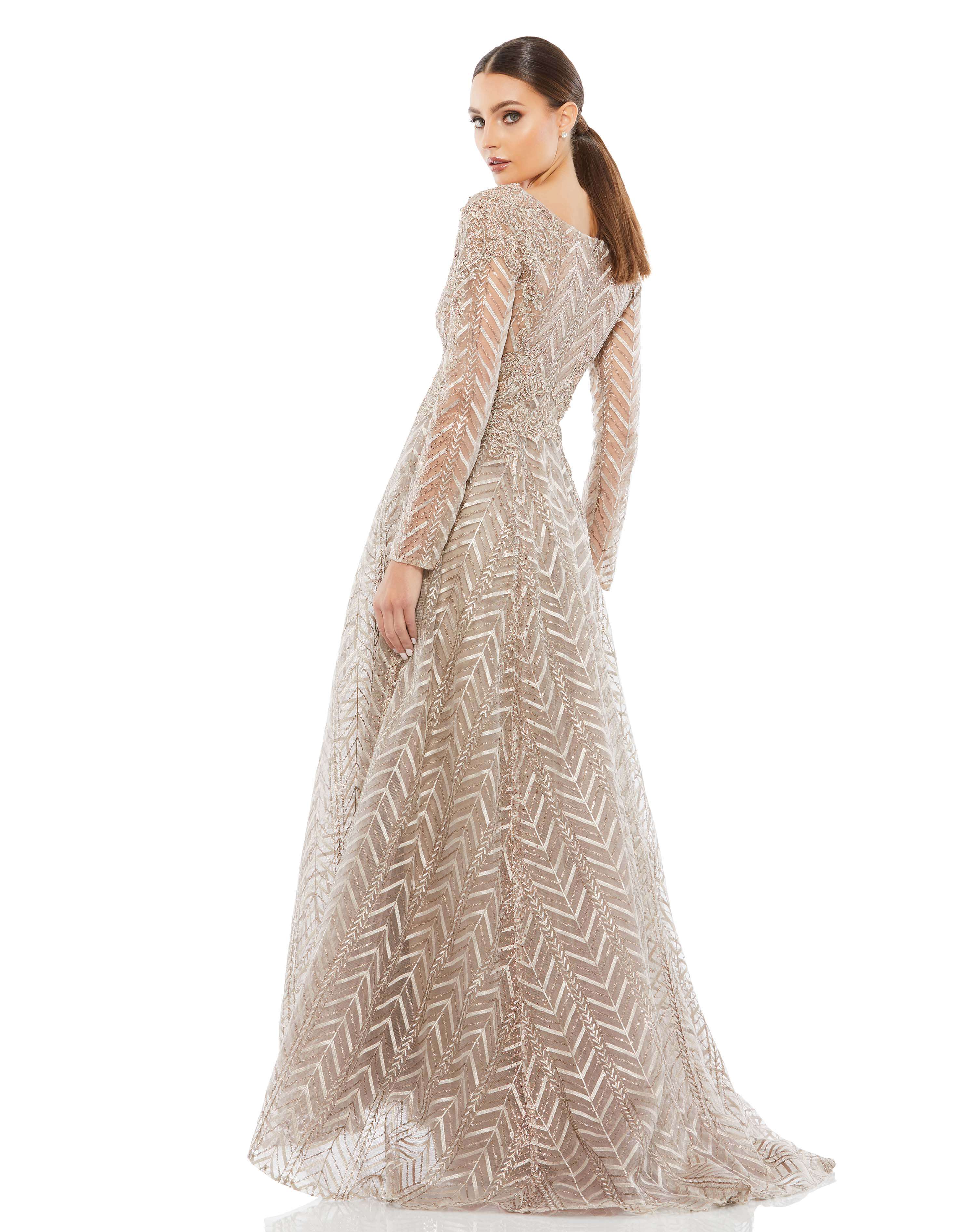 Embellished Illusion Long Sleeve Wrap Over A Line Gown